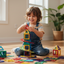 Child playing with colorful building blocks on a wooden floor.