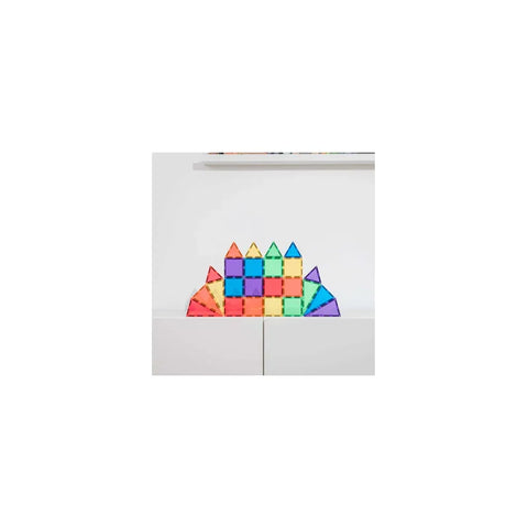 Rainbow magnetic building blocks set for kids, assembled in a castle shape on a white surface.