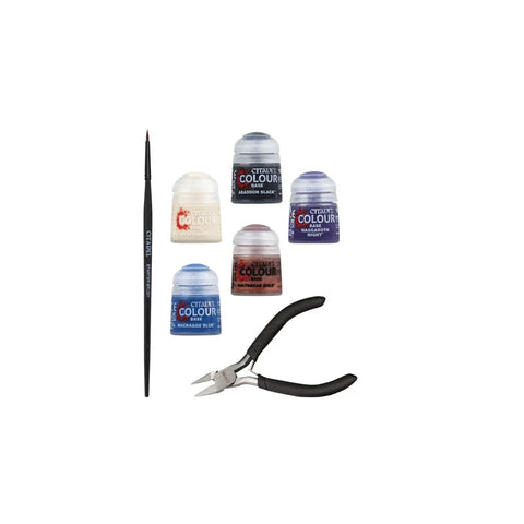 Miniature painting kit with Citadel Colour paints, paintbrush, and modeling clippers.