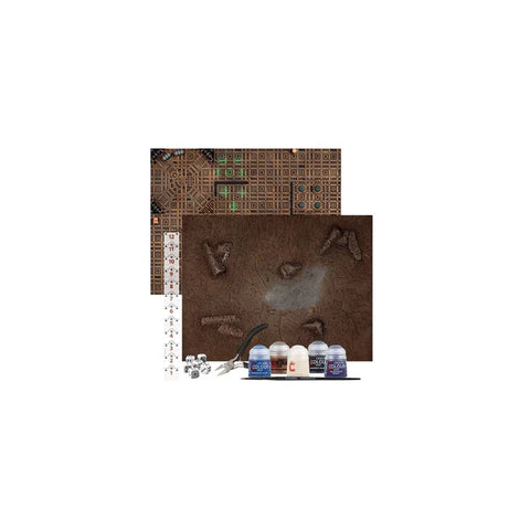 Warhammer 40,000 introductory board game set with paint pots, dice, ruler, and terrain mats