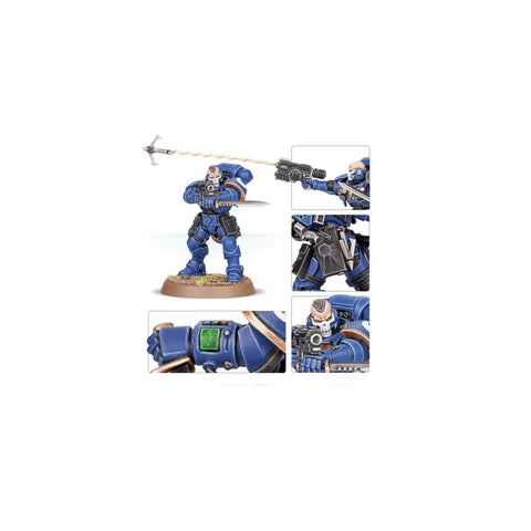 Blue armored Space Marine miniature with rifle, sword, and detailed accessories on display base.