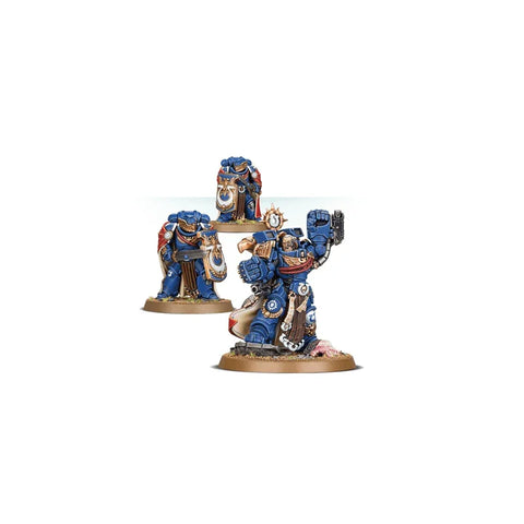 Painted blue-armored sci-fi miniatures with gold details, collectible tabletop figures set.