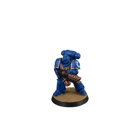 Blue armored sci-fi space marine miniature figure holding a detailed weapon, on a base
