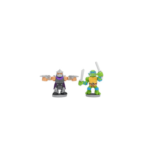 Two collectible action figures posed for battle, one armored villain and one green turtle hero, both holding weapons.