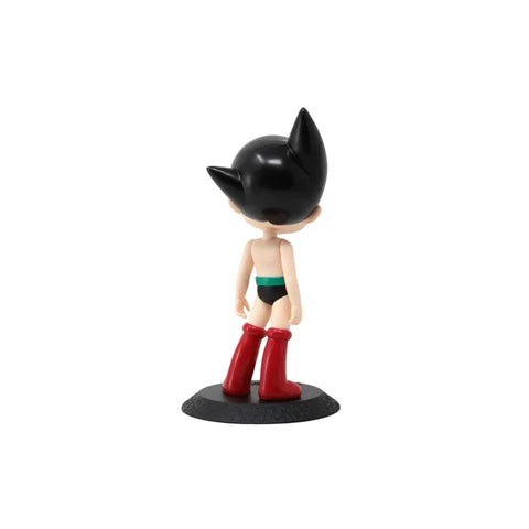 Astro Boy Qposket collectible figure with black hair, red boots, shown from behind