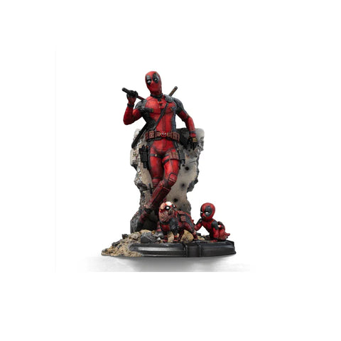 Deadpool collectible statue with mini Deadpool figures on detailed rocky base