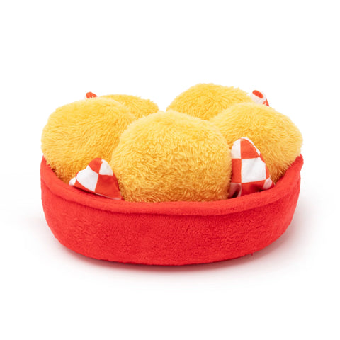 Plush toy chicken nuggets in soft red basket with checkered plush details on white background