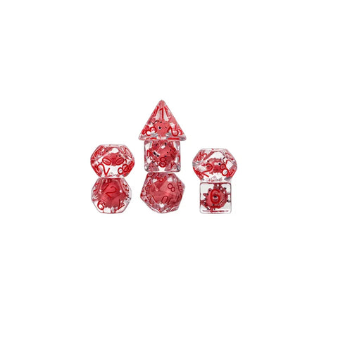 Clear resin polyhedral dice set with red D&D-themed designs, arranged on white background.