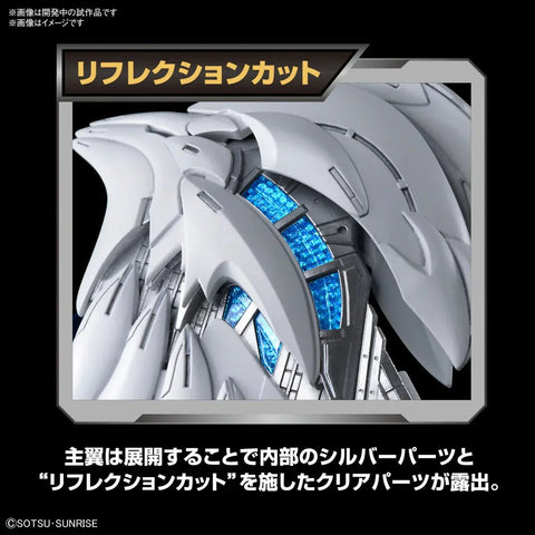 Close-up of silver and blue mechanical model wings with intricate, futuristic toy parts.