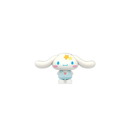 Cute white bunny collectible toy figure in blue swimsuit with yellow star, isolated on white background