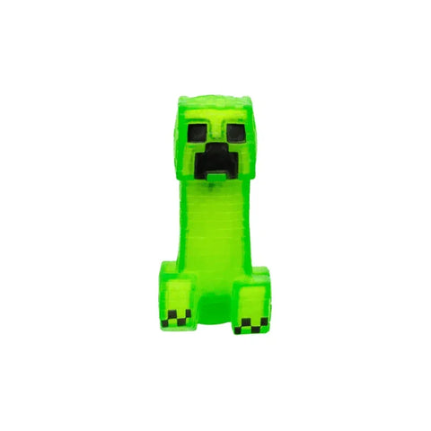Green pixelated Creeper action figure toy, inspired by video game, on white background