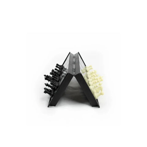 Foldable magnetic travel chess set with black and white plastic pieces, upright on board
