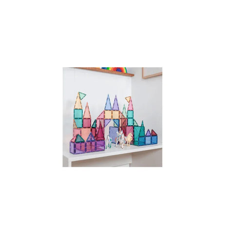 Pastel magnetic building blocks set assembled as a colorful castle on a shelf with toy figures.