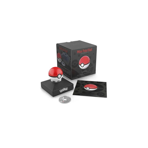 Mini Poké Ball die-cast replica collectible with display case, box, coin, and info card