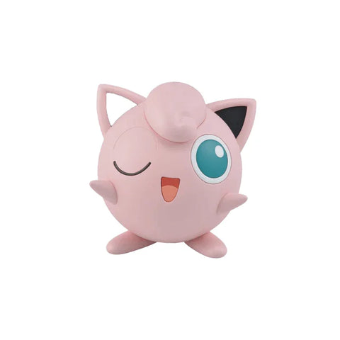 Jigglypuff plastic model kit toy figure, pink with one eye winking, on white background