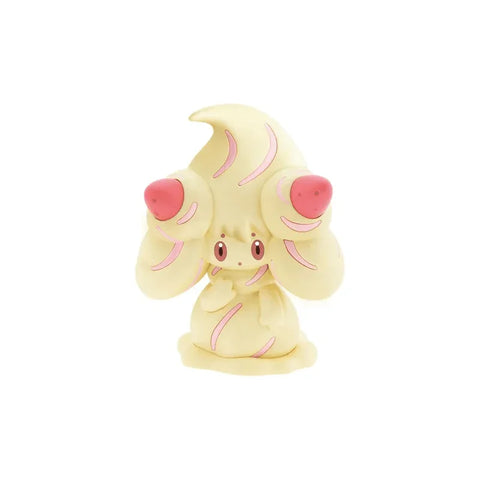 Alcremie model kit figure, yellow and pink collectible toy on white background