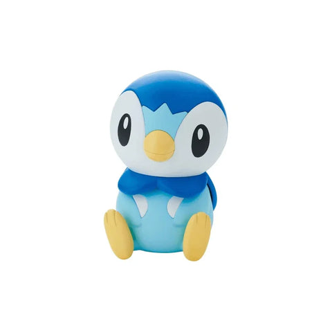 Blue and yellow Piplup Pokemon model kit toy sitting on white background