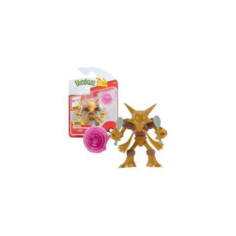 Alakazam action figure toy with spoons and pink accessory, packaged in branded box