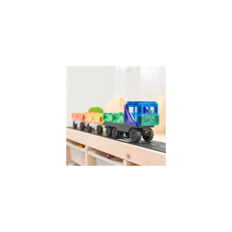 Colorful magnetic toy train set with rainbow carriages on a wooden track