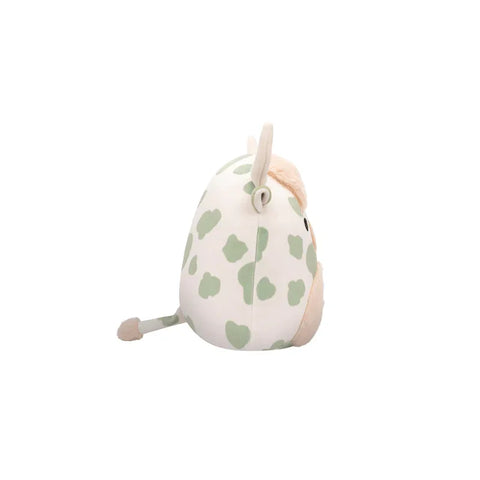 Plush highland cow toy with green spots, round body, and soft beige horns