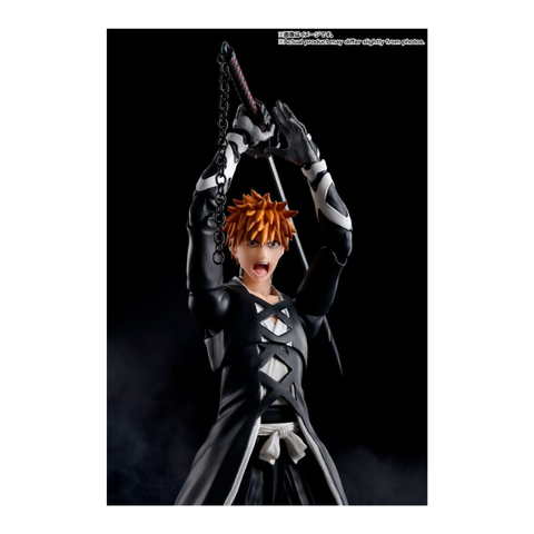 Anime action figure with spiky orange hair, black outfit, holding sword overhead on black background