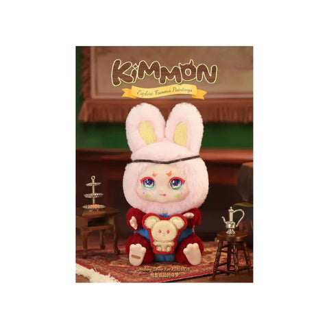 Plush bunny toy with large ears, colorful eyes, and red outfit, displayed in a dollhouse setting