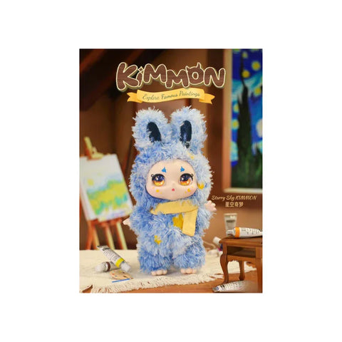 Cute collectible doll in fluffy blue bunny costume with art supplies and easel in studio