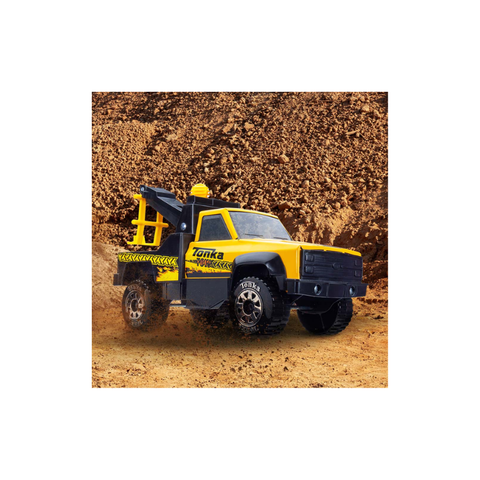 Yellow toy tow truck for kids on dirt, outdoor construction vehicle toy
