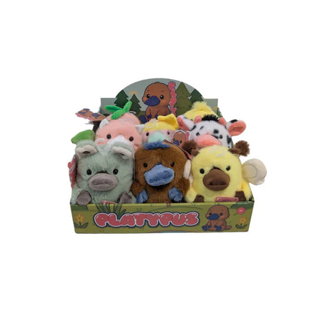 Box of colorful plush animal toys including platypus and farm animals on display