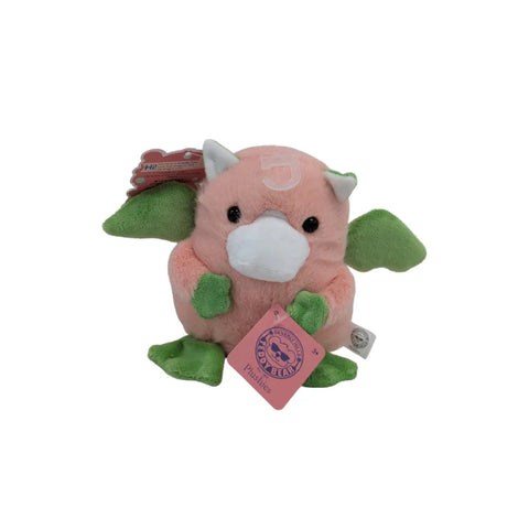 Pink and green dragon plush toy with wings and tag, collectible stuffed animal