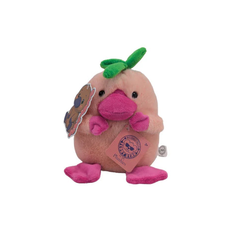 Plush pink platypus toy with green leaf on head and pink feet, collectible plushie