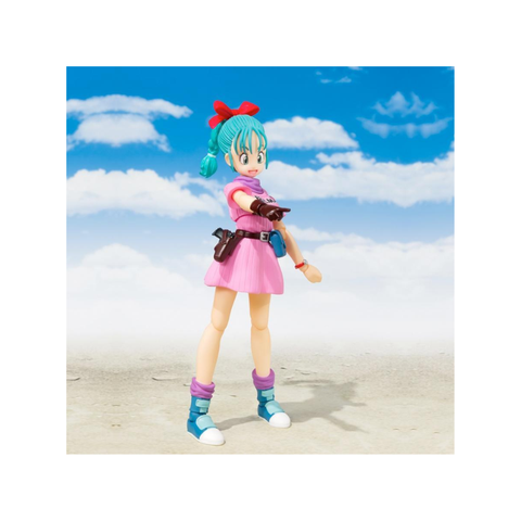 Anime action figure with blue hair and pink dress, posed outdoors under a blue sky