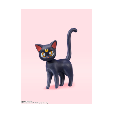 Anime black cat figurine with crescent moon on forehead, collectible toy on pink background