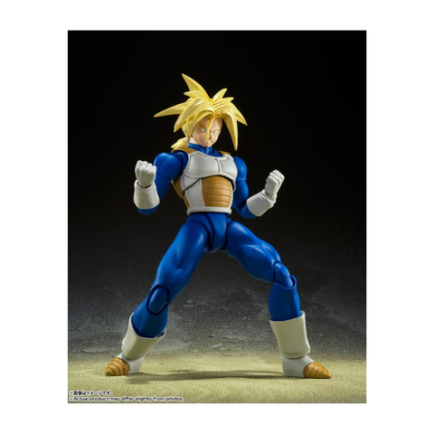 Anime action figure in blue and white armor with spiky yellow hair on a dark background