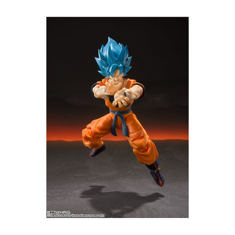 Anime action figure with blue spiky hair and orange outfit in dynamic fighting pose