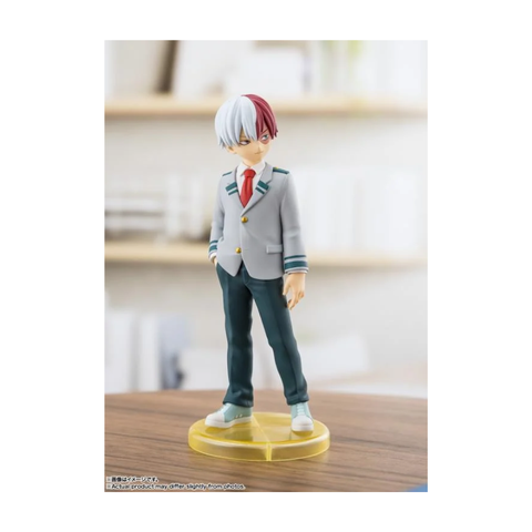 Anime character figure with dual-colored hair in school uniform standing on a display base