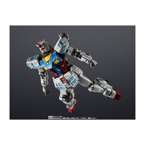Articulated robot action figure with detailed armor, blue, red, and white parts on gray background