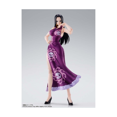 Anime action figure in purple dress with skull patterns, collectible toy, posed on white background.