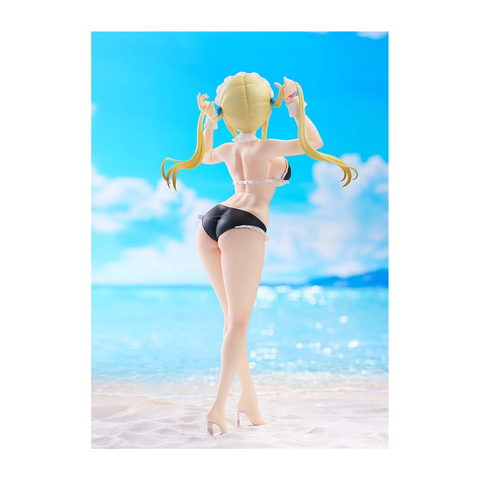 Anime girl collectible figure in black bikini standing on sandy beach with ocean backdrop