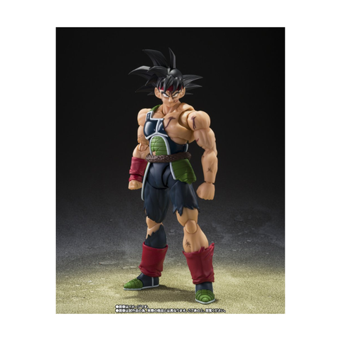 Anime action figure with muscular build, spiky black hair, and battle-damaged armor on display