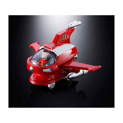Red toy spaceship with figure inside, collectible diecast vehicle on black background