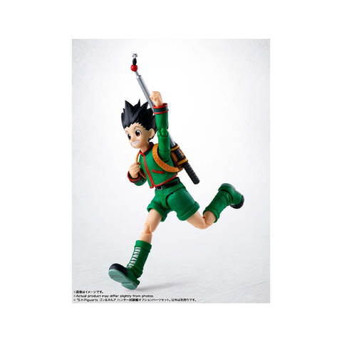 Anime action figure with spiky black hair, green outfit, and fishing rod in dynamic pose