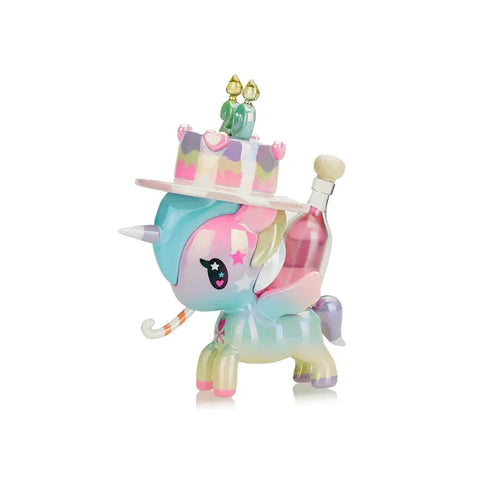 Colorful unicorn toy with pastel rainbow body, cake hat, and birthday candles collectible figure