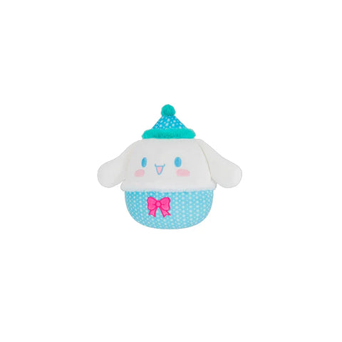 Cute plush toy with floppy ears, blue polka dot outfit, pink bow, and teal hat