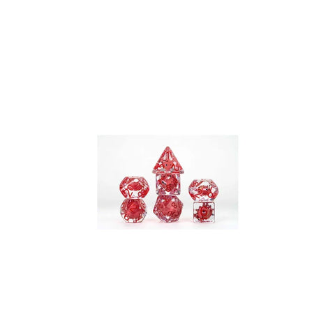 Red and clear polyhedral dice set with gears for tabletop games on white background