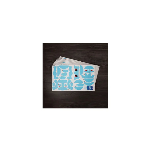 Blue squirrel 3D puzzle model kit sheets on a dark wooden table