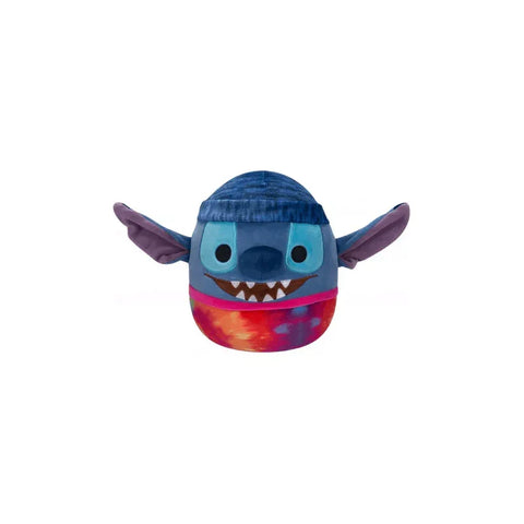 Blue alien plush toy with big ears, blue cap, and multicolored base on white background